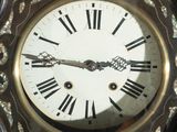 a close up of a clock with roman numerals on it