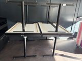 three tables that are sitting in the middle of a room