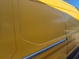 a yellow van that is parked on the side of the road