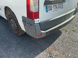 a white van that is parked on the side of the road