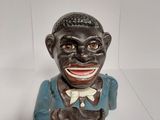 a figurine of a man with a smile on his face