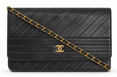 a chanel black quilted leather shoulder bag with gold chain