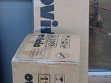 two boxes sitting on the ground outside of a building
