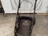 a baby stroller that is sitting on the floor