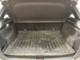 a trunk of a car that has a keyboard in it
