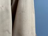 a close up of a jacket hanging on a hanger
