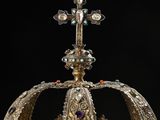 a close up of a crown with a cross on top of it