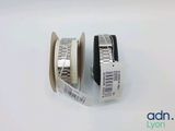 two rolls of tape on a white surface