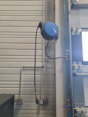 an image of a garage with a tv mounted to the side of the wall