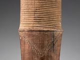 a brown vase with a chain around it