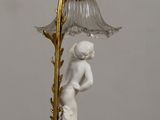 a lamp that is sitting on a table next to a wall
