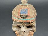 an image of a skull with a hat on it ' s head