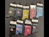 six pairs of women ' s socks with flowers on them