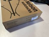 a box that is sitting on a table with a lamp on it