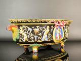 an image of a black and gold bowl on a table