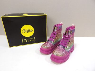 purple boots with glitter on them sitting next to a black box