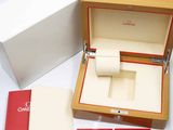 a box with a watch inside of it on a table