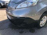 a silver car that is parked in a parking lot