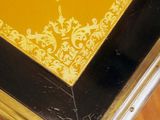 a yellow and black table with a gold border on it