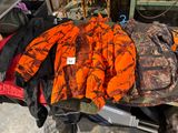 a pile of hunting gear sitting on a table