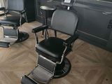 two black chairs sitting in a room next to each other