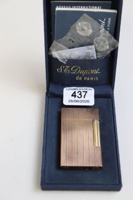 a small box with a lighter in it on a table