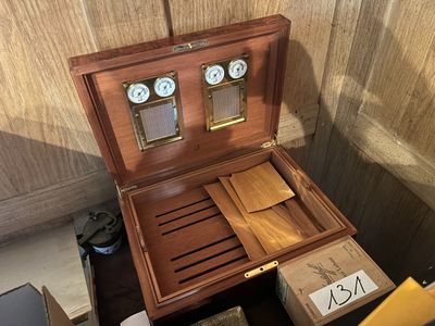 a wooden box that has a clock inside of it