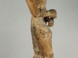 statue of a man holding a bird in his hand
