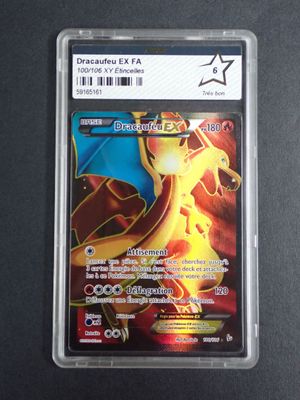 a close up of a card in a plastic holder on a table