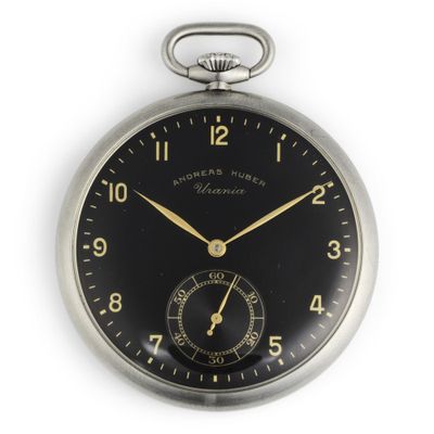 a silver pocket watch with a black face on a white background