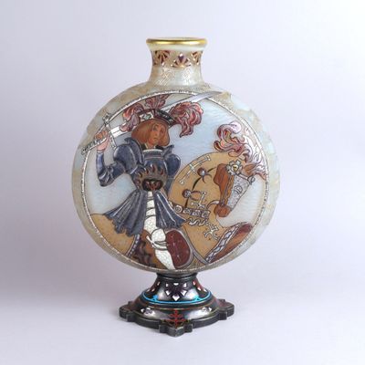 a vase with a picture of a woman on it