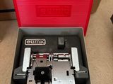 an open box with a sewing machine in it sitting on a table