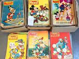 several mickey mouse books are stacked on top of each other