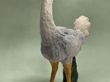 a statue of an ostrich standing on a rock