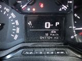 a close up of a car dashboard with a clock on it