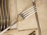 a fork and a knife in a case of silverware