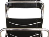 black leather and chrome chair with magazine holder on the back
