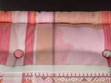 an image of a close up of a curtain with buttons on it