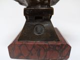 sculpture of a bust of a man on a marble base