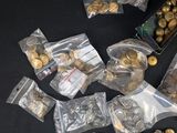 a lot of gold coins and other items on the table