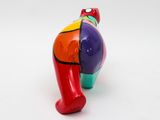 a colorful elephant figurine on a white surface