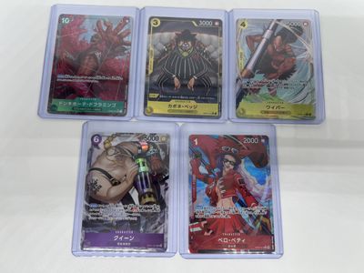 six card game cards in plastic cases sitting on a white surface