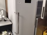 a white refrigerator and freezer in a kitchen
