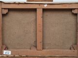an old wooden easel with a piece of cardboard on top of it