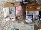 many pairs of socks that are sitting on the floor