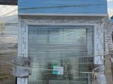 a picture of a window on a pallet in front of a building