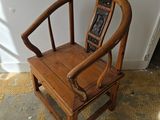 a wooden chair that is sitting on the floor
