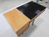 an image of a desk with a black and brown top