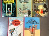 several children ' s books are lined up on a table