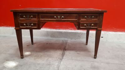 a wooden desk with drawers and drawers on top of it